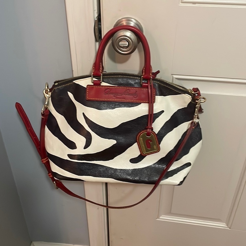 Genuine Dooney and Bourke leather zebra with red trim satchel